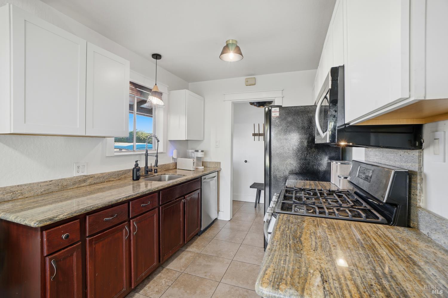 823 Shell Avenue Martinez, CA 94553 - Photo 16 of 39 a kitchen with a sink a stove and refrigerator