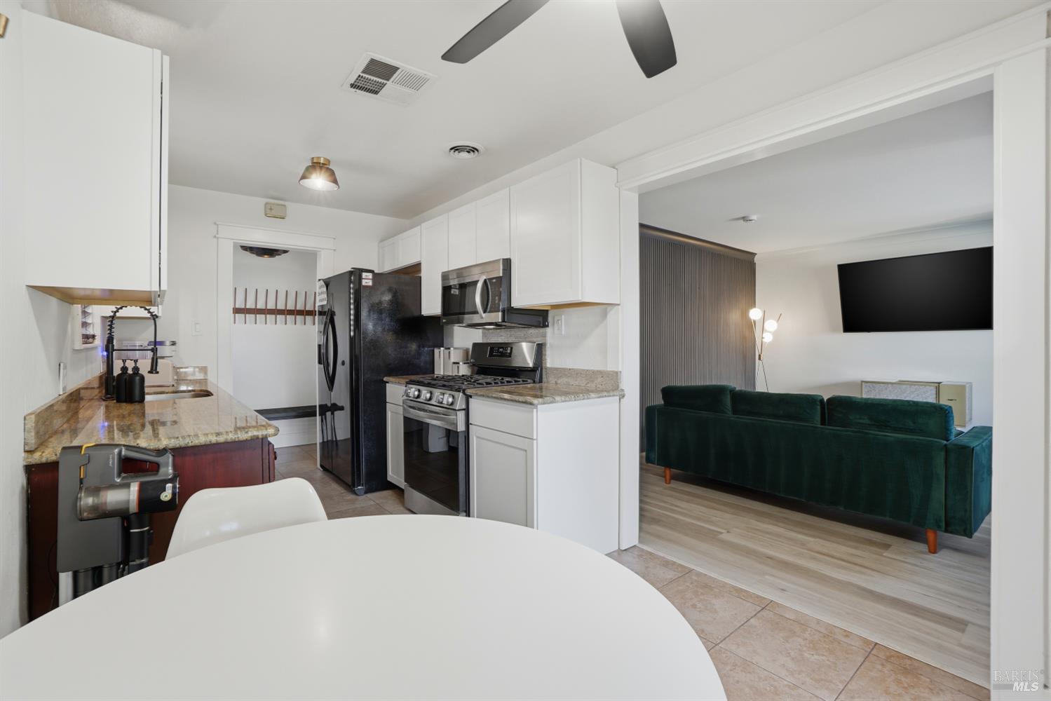 823 Shell Avenue Martinez, CA 94553 - Photo 20 of 39 a kitchen with a refrigerator and a stove top oven