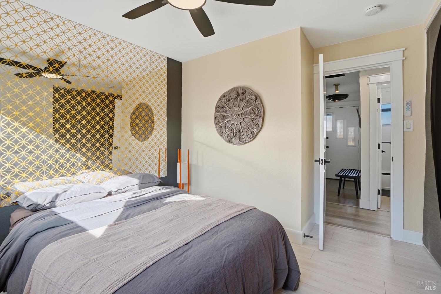 823 Shell Avenue Martinez, CA 94553 - Photo 25 of 39 a bedroom with a bed and a chandelier