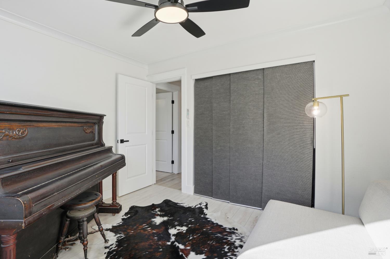 823 Shell Avenue Martinez, CA 94553 - Photo 26 of 39 a bedroom with a bed and a chandelier