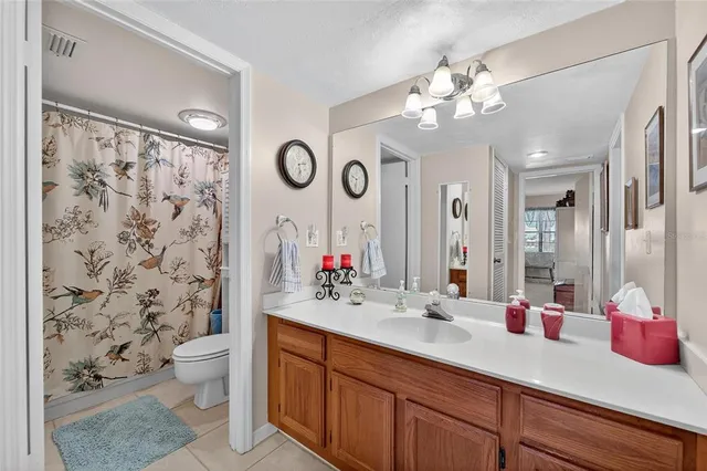 a bathroom with a shower curtain and a sink