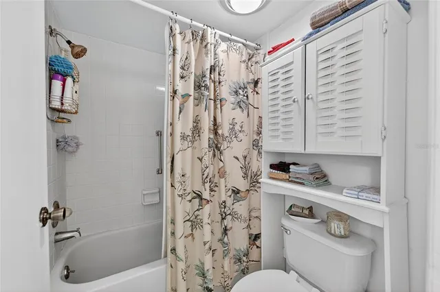 a bed room with a bed and a window