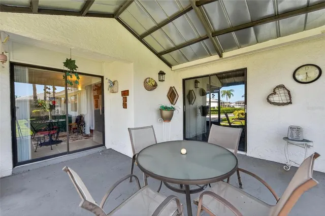 a room with painting on wall and a potted plant