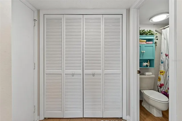 a view of hallway with furniture and a livingroom