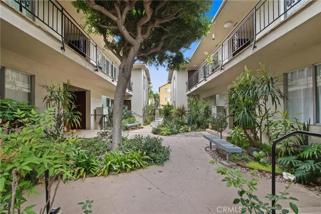 a view of a pathway both side of house
