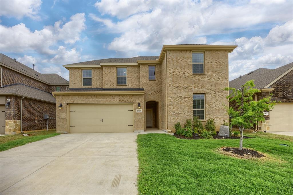 3808 High Country Road Aubrey, TX 76227 - Photo 1 of 36 Two-story brick exterior with a two-car garage, concrete driveway, and front lawn landscaping