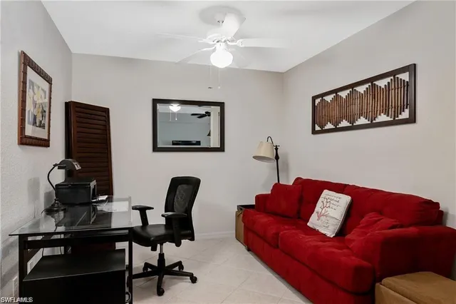 a living room with furniture and a chair
