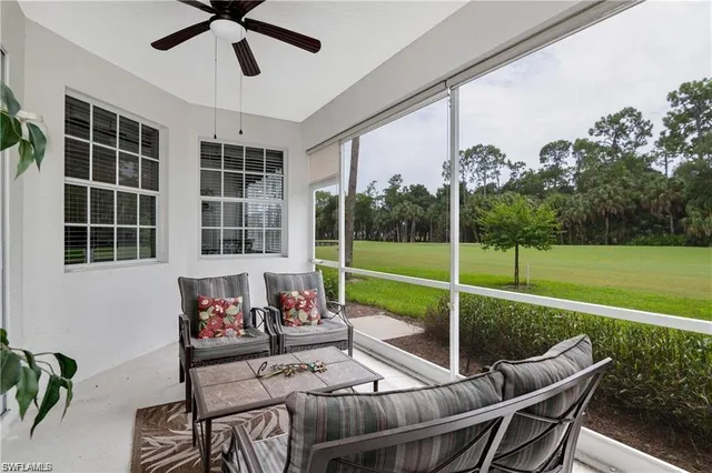 a view of a house with backyard and porch