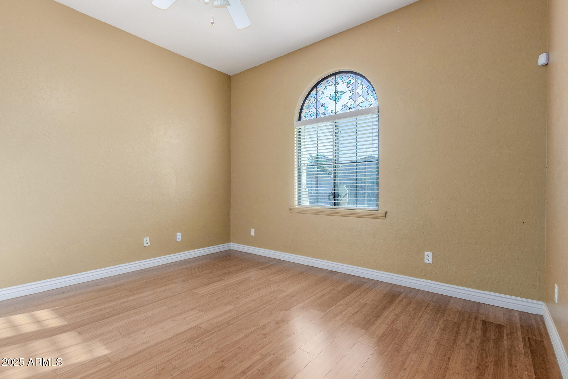 14380 West Monte Vista Road Goodyear, AZ 85395 - Photo 23 of 37 an empty room with a window