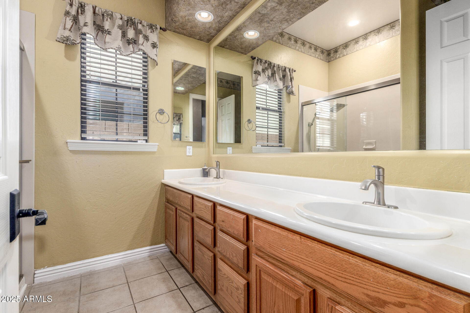 14380 West Monte Vista Road Goodyear, AZ 85395 - Photo 29 of 37 a bathroom with a sink and a mirror