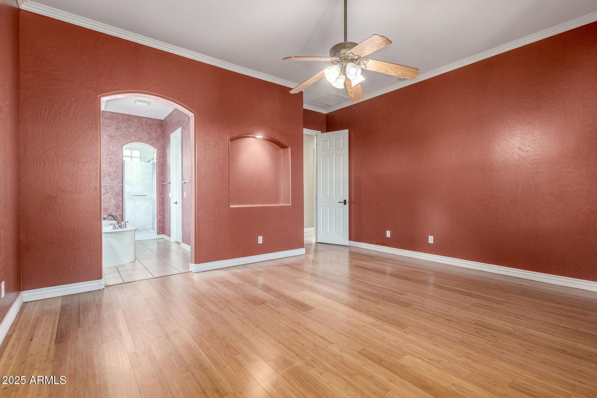 14380 West Monte Vista Road Goodyear, AZ 85395 - Photo 30 of 37 a view of an empty room with wooden floor and a chandelier