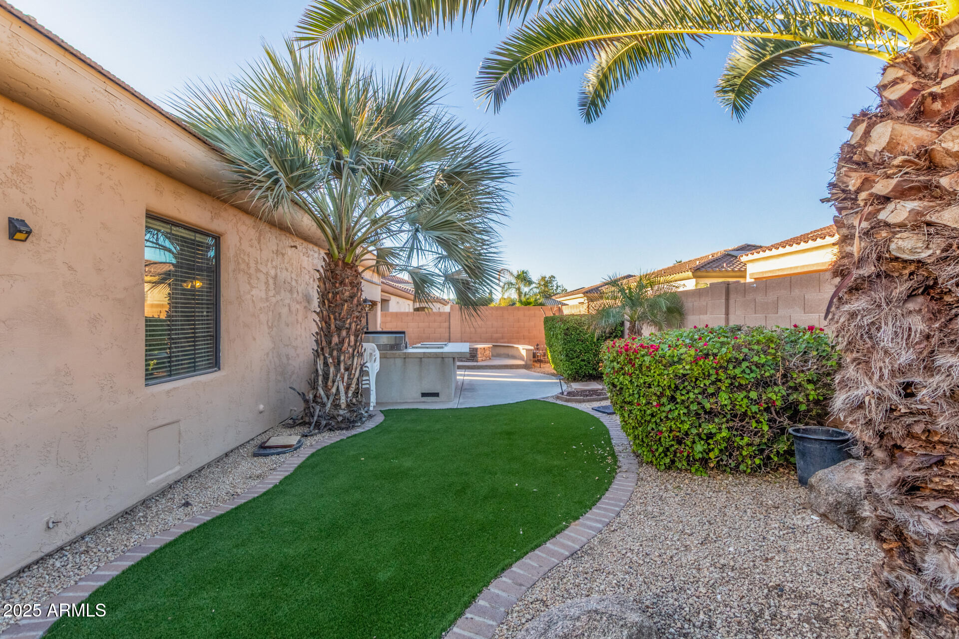 14380 West Monte Vista Road Goodyear, AZ 85395 - Photo 37 of 37 a view of a house with a yard and potted plants