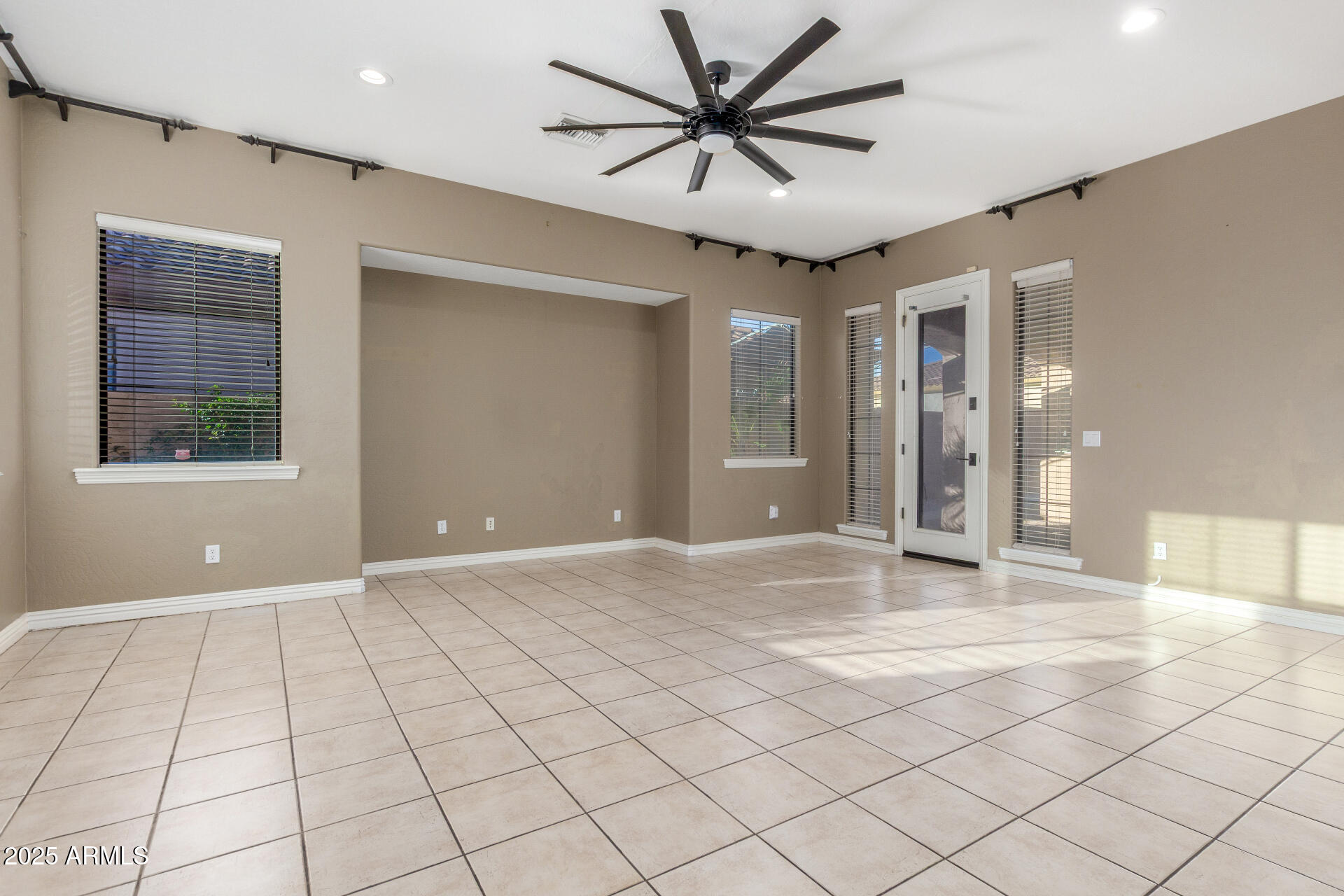14380 West Monte Vista Road Goodyear, AZ 85395 - Photo 10 of 37 a view of an empty room with a window