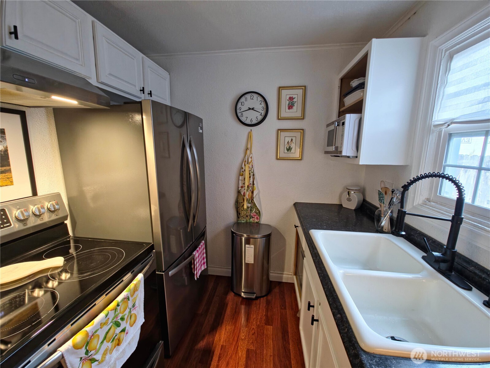 212 Douglas Street Longview, WA 98632 - Photo 13 of 20 a kitchen with stainless steel appliances granite countertop a refrigerator and a stove top oven