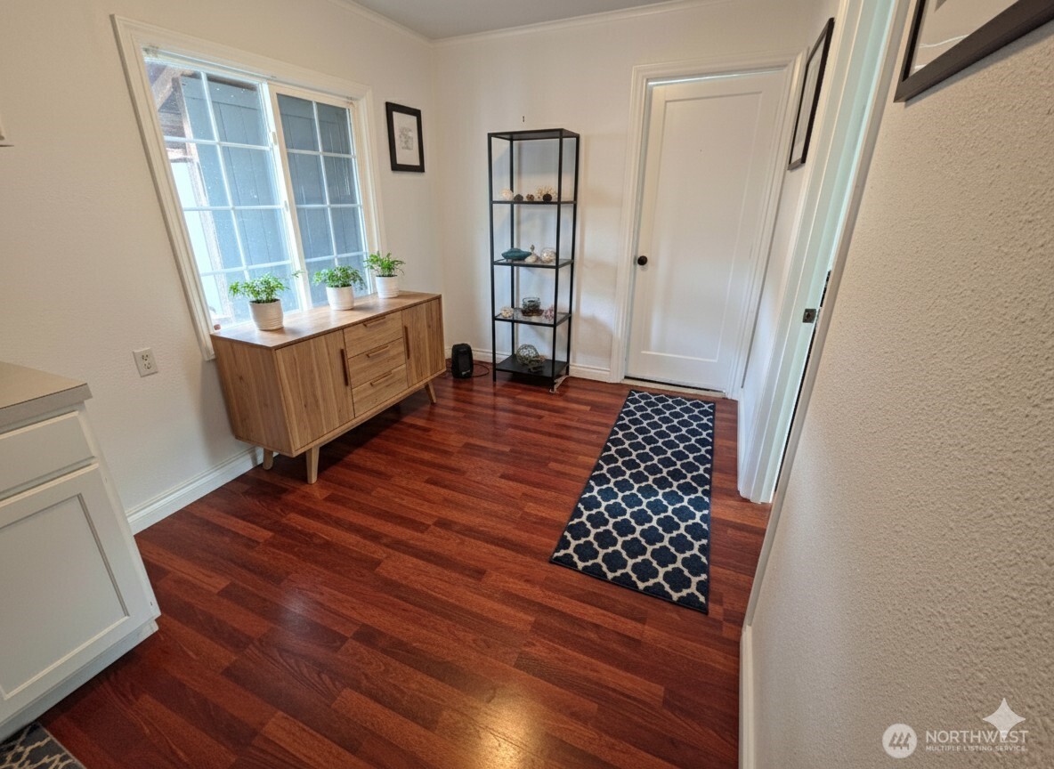 212 Douglas Street Longview, WA 98632 - Photo 14 of 20 a living room with wooden floor and a rug