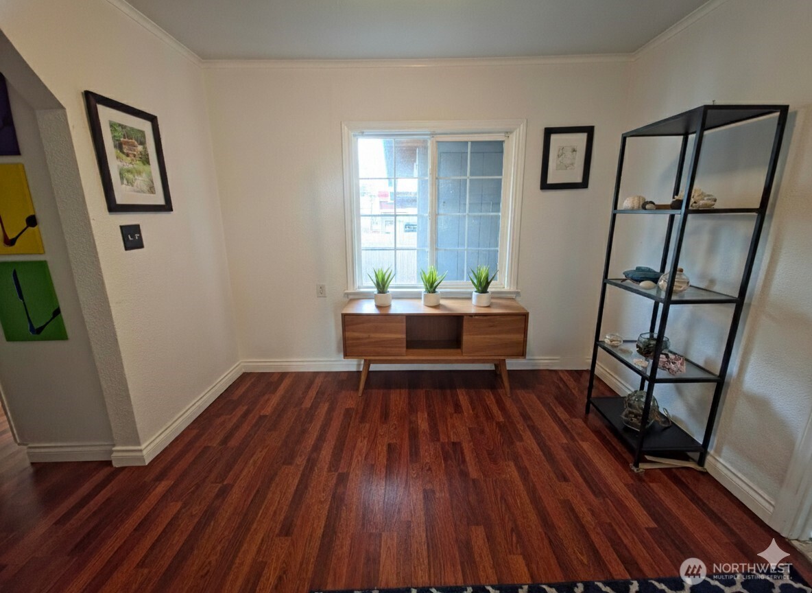 212 Douglas Street Longview, WA 98632 - Photo 15 of 20 a room with wooden floor and furniture