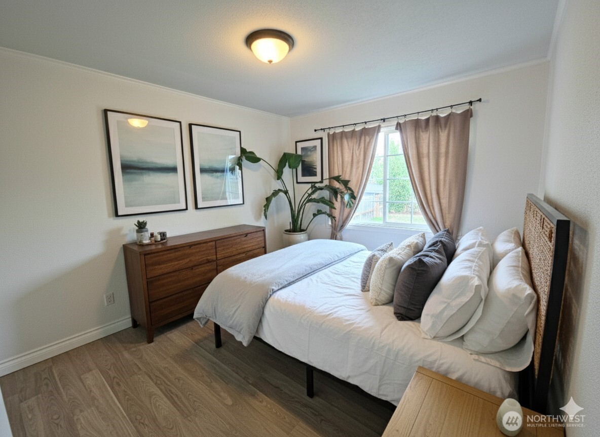 212 Douglas Street Longview, WA 98632 - Photo 5 of 20 a bedroom with a bed and a window