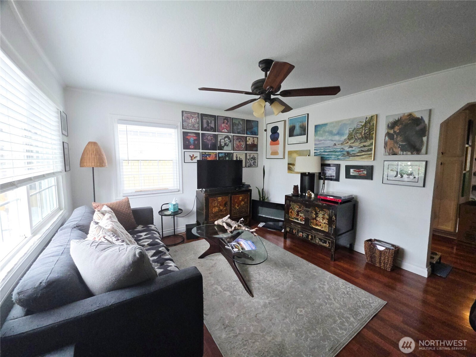 212 Douglas Street Longview, WA 98632 - Photo 10 of 20 a living room with furniture a flat screen tv and a large window