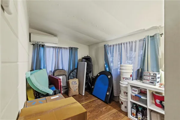 a view of a workspace with furniture and bedroom