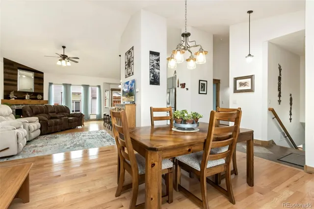a kitchen with stainless steel appliances granite countertop a stove refrigerator and cabinets