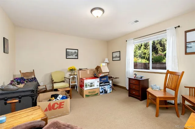 an aerial view of a house with a swimming pool and outdoor seating
