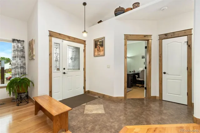 a living room with furniture and a rug