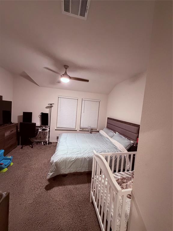 2001 Juniper Pass Way Mesquite, TX 75149 - Photo 8 of 12 Bedroom with dark colored carpet, an office area, and a ceiling fan