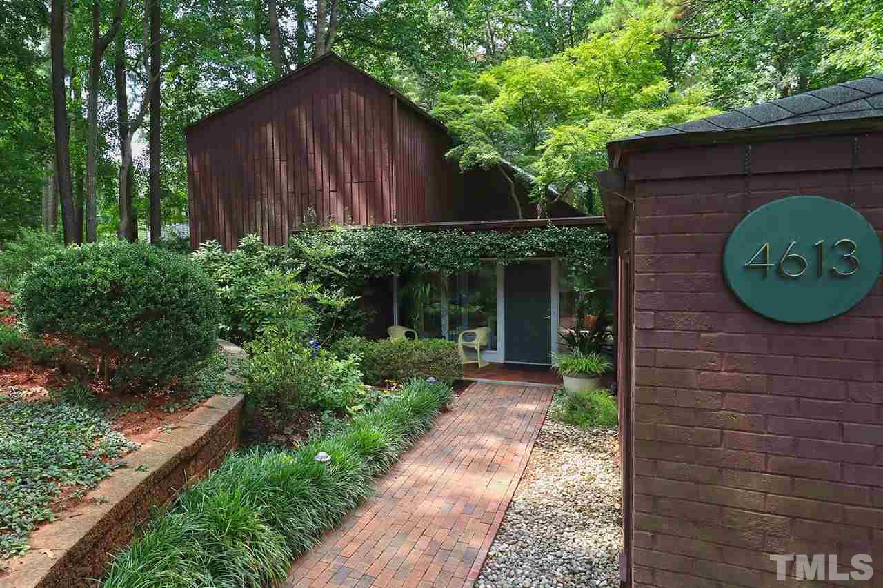 4613 Oak Park Road Raleigh, NC 27612 - Photo 1 of 25 a front view of a house with garden