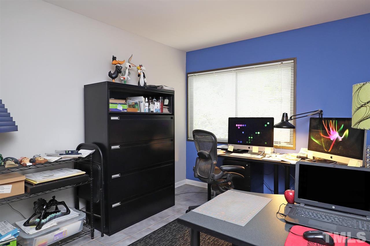 4613 Oak Park Road Raleigh, NC 27612 - Photo 12 of 25 a workspace with furniture and window