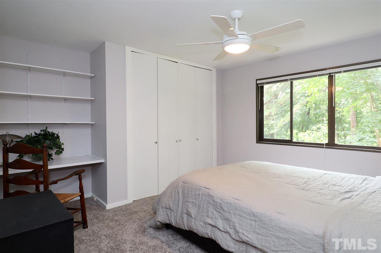 4613 Oak Park Road Raleigh, NC 27612 - Photo 14 of 25 a bedroom with a bed and a window