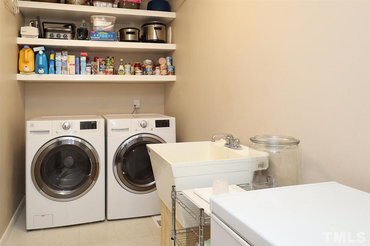 4613 Oak Park Road Raleigh, NC 27612 - Photo 20 of 25 a utility room with dryer and washer