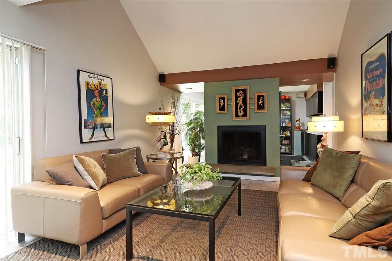 4613 Oak Park Road Raleigh, NC 27612 - Photo 3 of 25 a living room with furniture and a fireplace