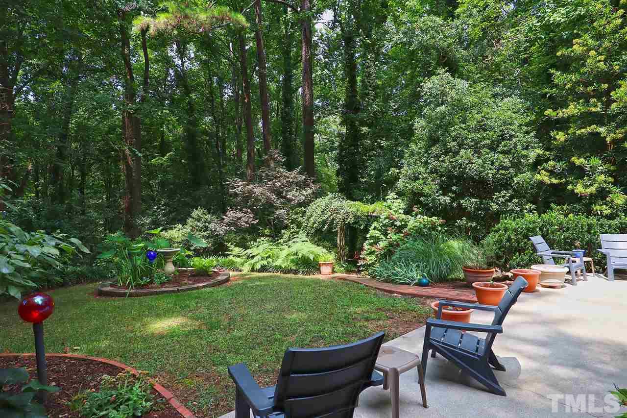 4613 Oak Park Road Raleigh, NC 27612 - Photo 23 of 25 a backyard of a house with outdoor seating