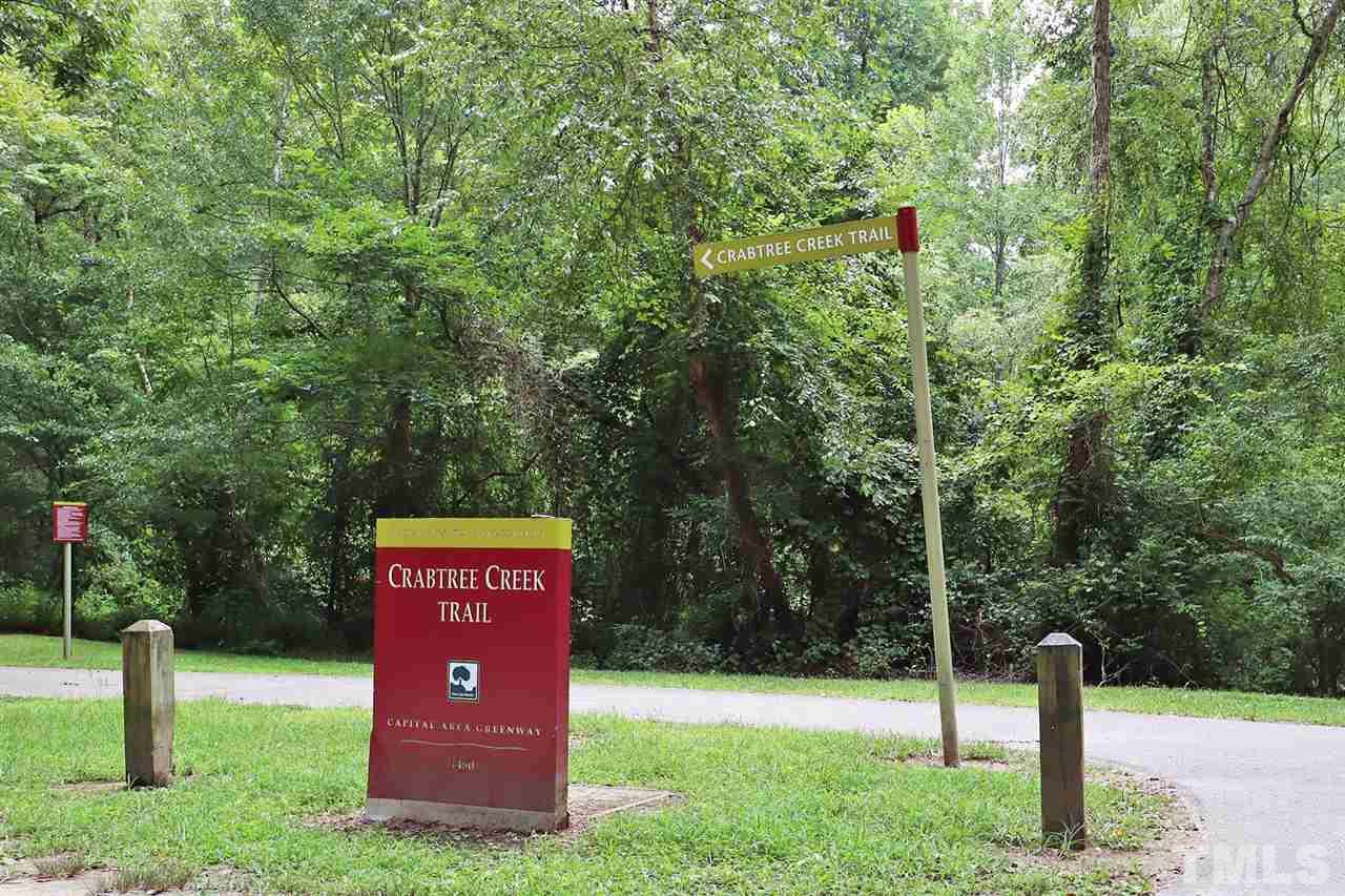 4613 Oak Park Road Raleigh, NC 27612 - Photo 25 of 25 a sign board with a park on the side of the road