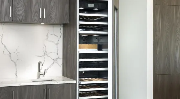 a view of a kitchen with a sink and cabinets