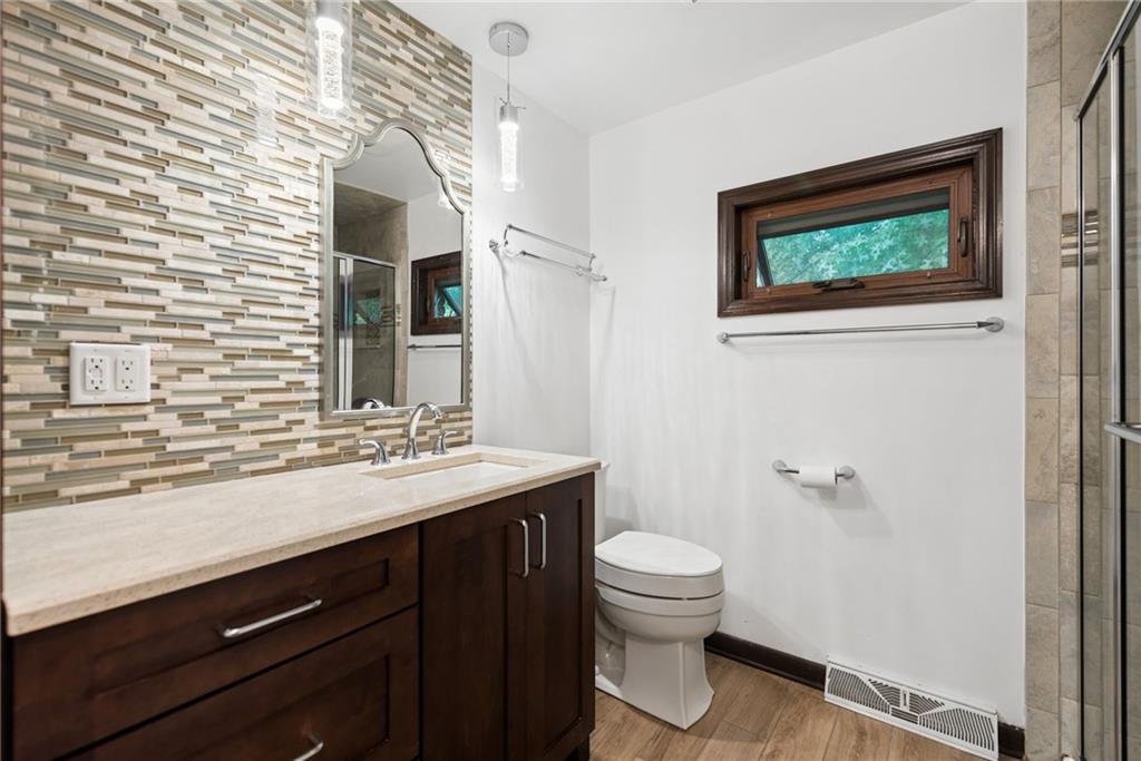 22 Buzzardtown Road Irwin, PA 15642 - Photo 20 of 44 a bathroom with a toilet a sink and mirror