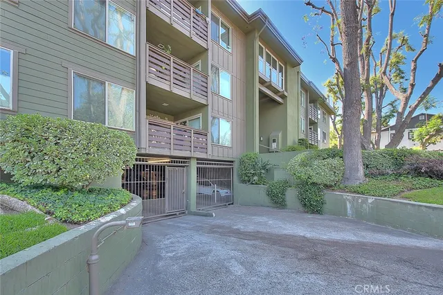 a backyard of a house with a yard and outdoor seating