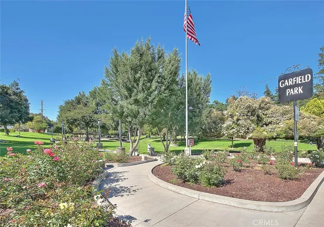 a view of a patio with a table chairs and a backyard