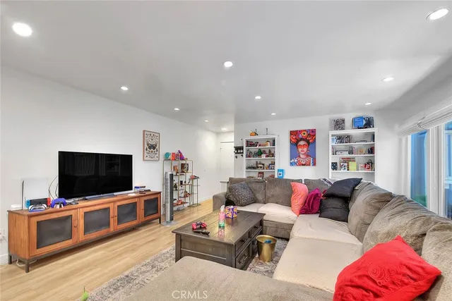 a kitchen with stainless steel appliances granite countertop a refrigerator and a stove
