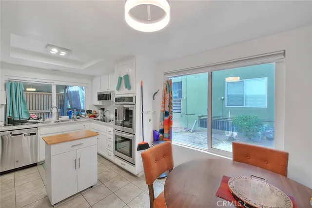a kitchen with stainless steel appliances granite countertop a stove and cabinets