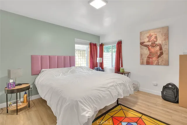 a room with furniture toys and a large window