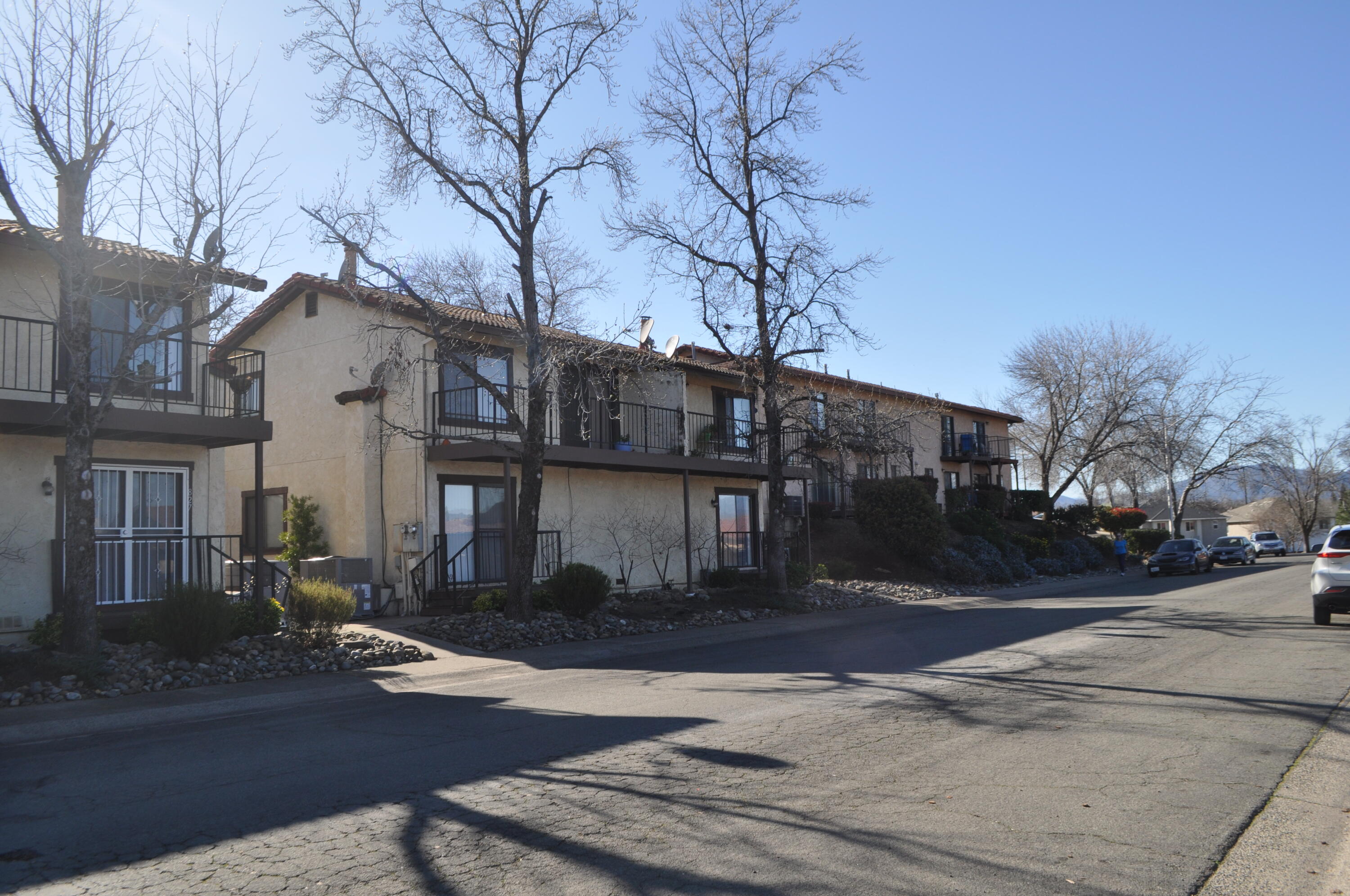 823 Mission Sierra Court Redding, CA 96003 - Photo 13 of 18 a front view of a house with a yard and tree s