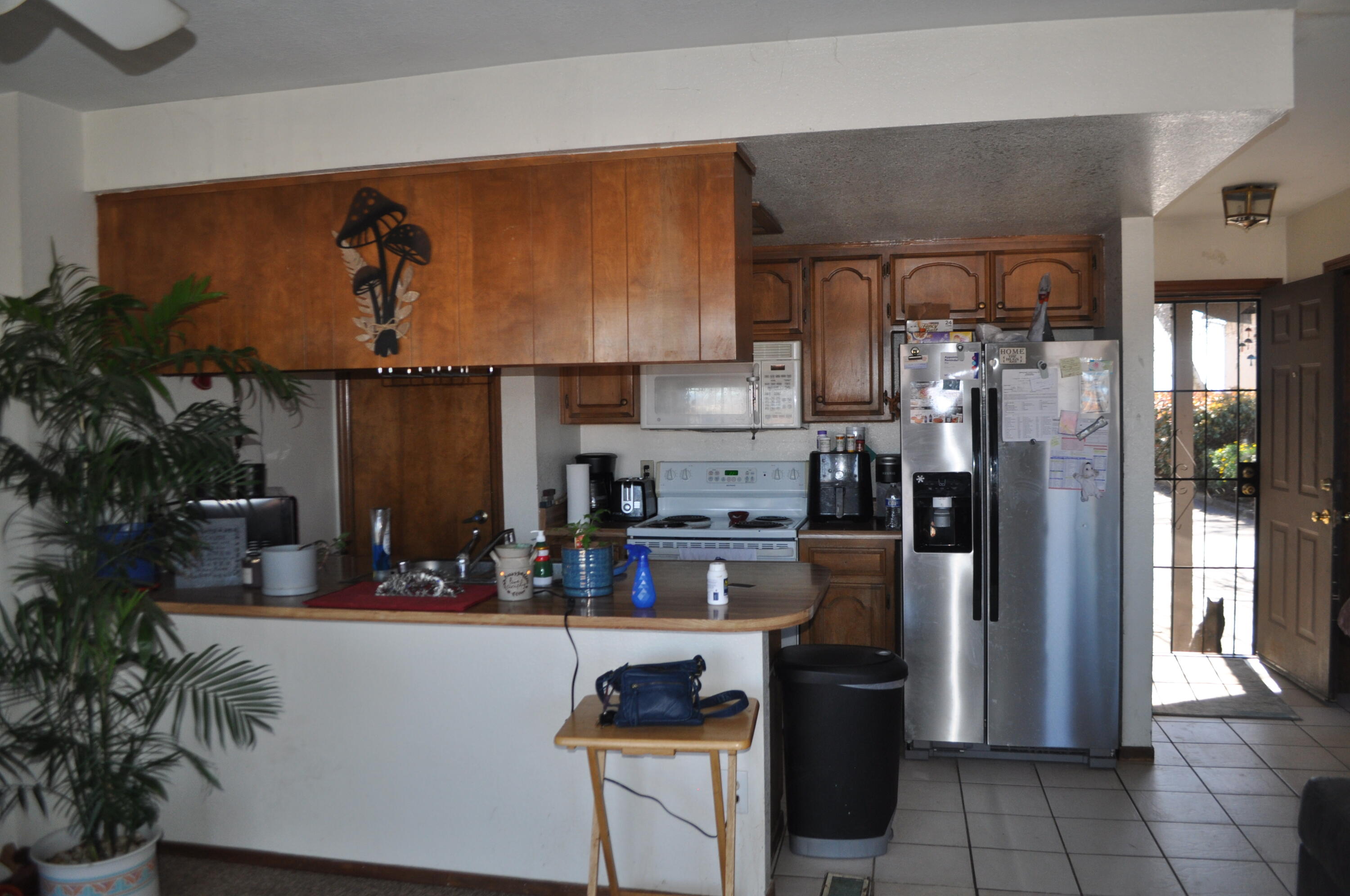 823 Mission Sierra Court Redding, CA 96003 - Photo 2 of 18 a kitchen with a refrigerator and a stove