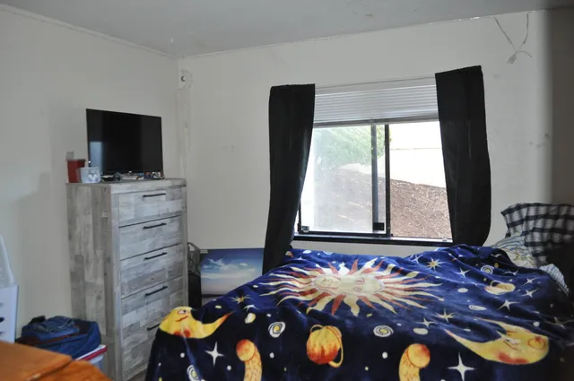 a room with furniture and flat screen tv