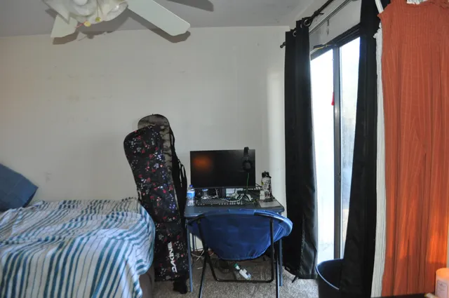 a bed room with furniture and a window