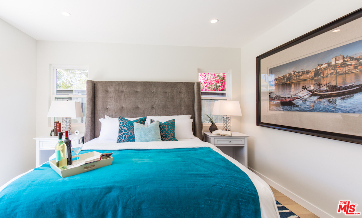 905 Lucille Avenue Venice, CA 90291 - Photo 11 of 24 a bed room with a bed and with painting on the wall