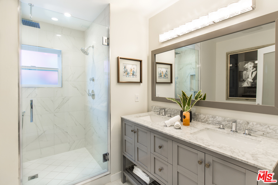 905 Lucille Avenue Venice, CA 90291 - Photo 12 of 24 a bathroom with a granite countertop sink mirror and shower