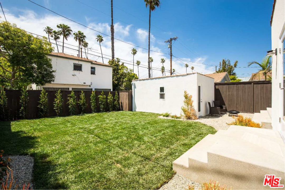 905 Lucille Avenue Venice, CA 90291 - Photo 22 of 24 a view of a white house with a yard and potted plants