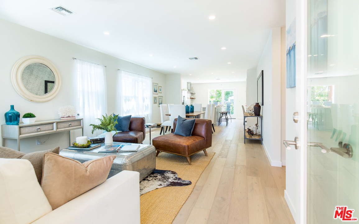 905 Lucille Avenue Venice, CA 90291 - Photo 4 of 24 a living room with furniture a large window and a wooden floor