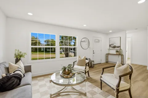 a living room with furniture and a window